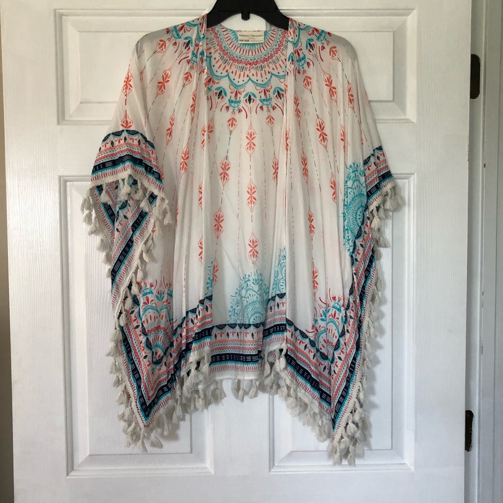 White, blue and red wrap with fringe detail